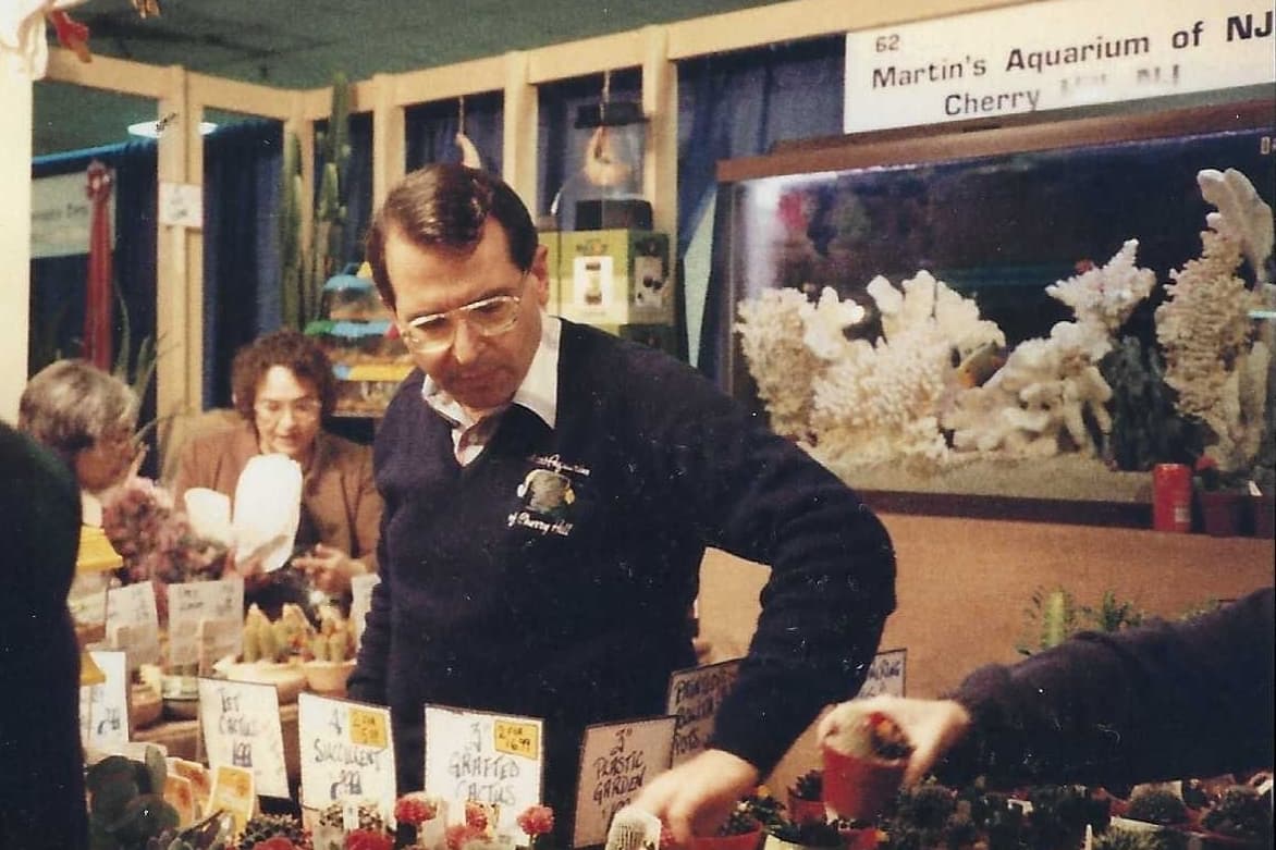 Vintage pet shop owner serving customers